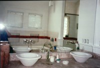 Mirror with faucets coming out of the mirror Mirror with faucets coming out of the mirror